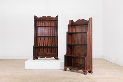 Lot 599 - A pair of Regency-style mahogany coromandel and ebonised waterfall bookcases