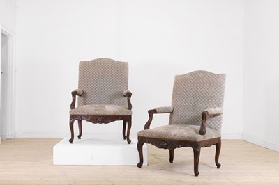 Lot 88 - A pair of Louis XV-style carved walnut fauteuils