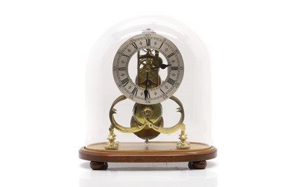 Lot 446 - A brass skeleton clock