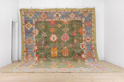 Lot 288 - A large Oushak wool carpet