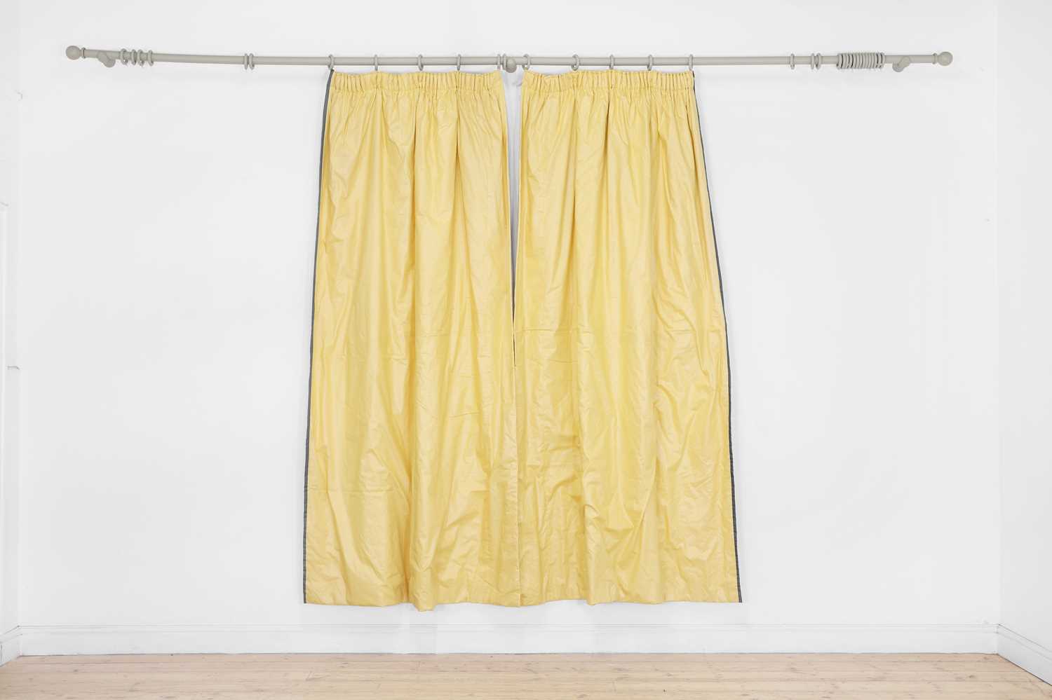 Lot 545 - Two pairs of yellow glazed cotton curtains