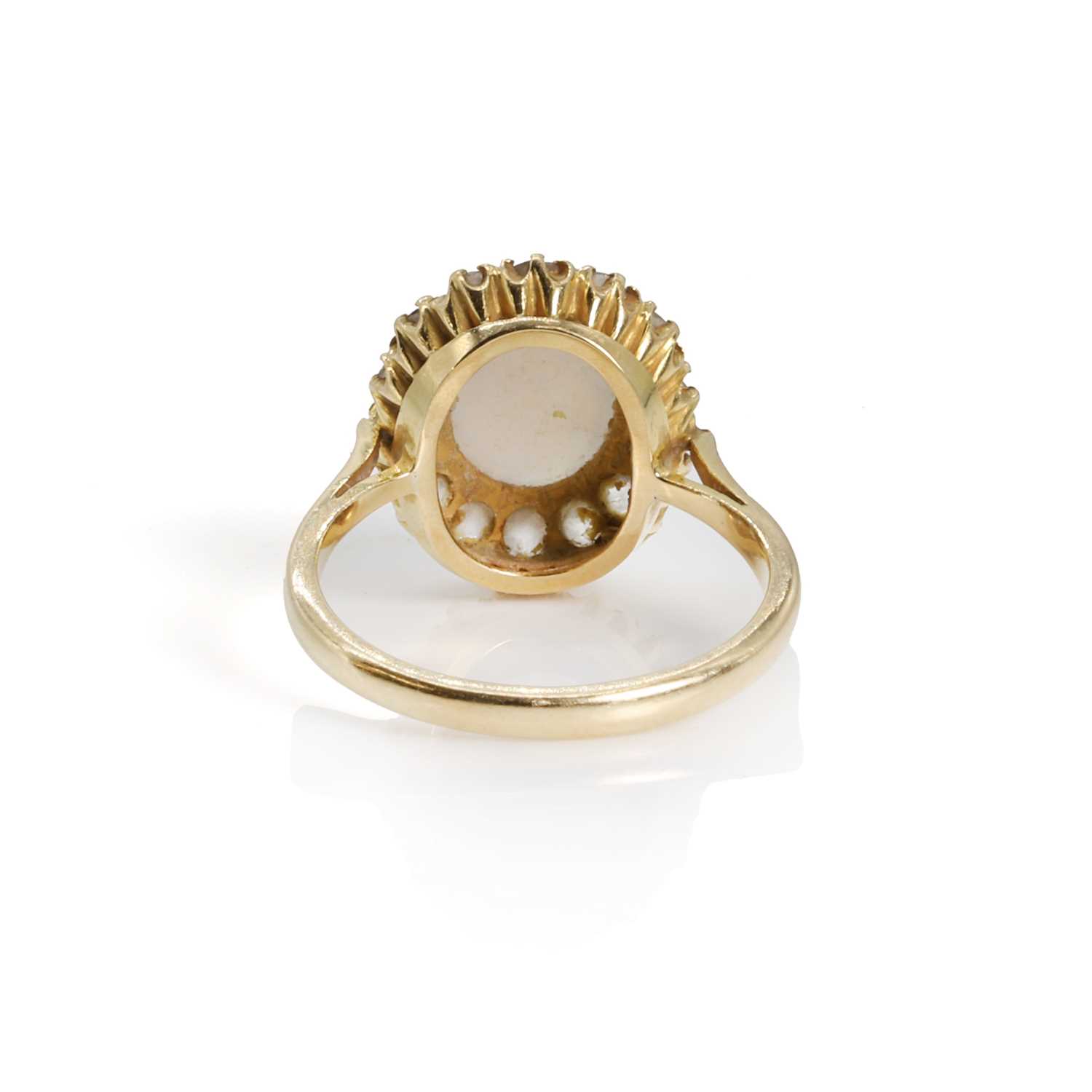 Lot 124 An opal and diamond cluster ring,