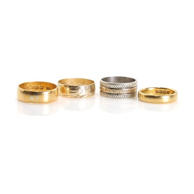 Lot 1322 - A group of four gold wedding rings