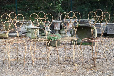 Lot 779 - A set of four French wrought iron bistro chairs