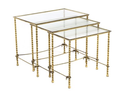 Lot 642 - A brass nest of tables