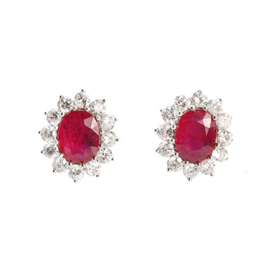 Lot 190 - A pair of ruby and diamond cluster earrings