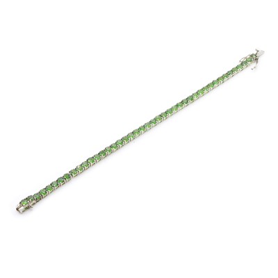 Lot 1276 - A sterling silver chrome diopside line bracelet