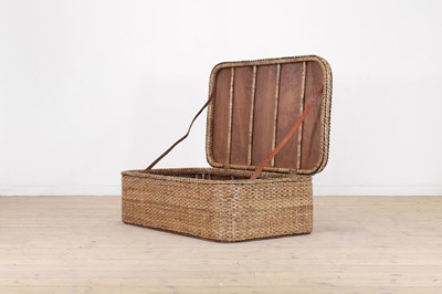 Lot 181 - A woven wicker ottoman