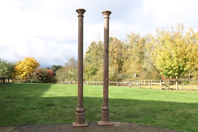 Lot 630 - A near pair of cast iron columns