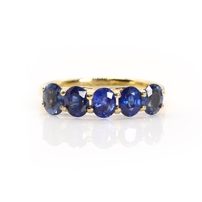 Lot 1151 - An 18ct gold five stone sapphire ring, by Iliana