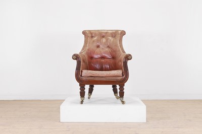 Lot 212 - A George IV mahogany and leather bergère library armchair