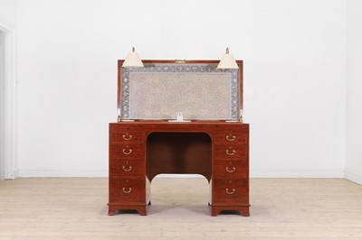 Lot 578 - A George III-style mahogany kneehole desk by George Betjemann & Sons