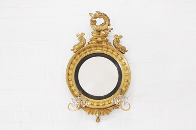 Lot 584 - A Regency giltwood convex mirror