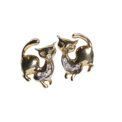 Lot 1087 - A pair of diamond cat stud earrings