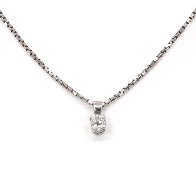 Lot 1102 - A white gold diamond single stone pendant