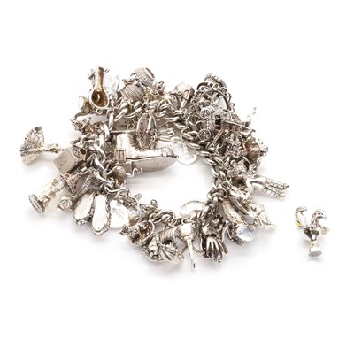 Lot 1406 - A silver charm bracelet