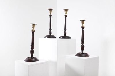 Lot 427 - Two pairs of George III-style mahogany and brass library candlesticks