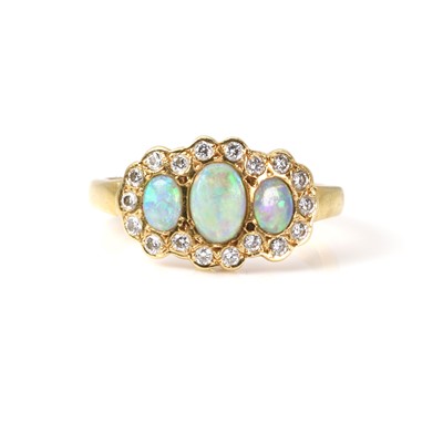 Lot 1227 - An 18ct gold opal and diamond triple cluster ring