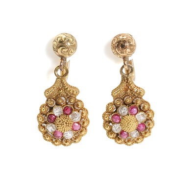 Lot 1009 - A pair of ruby and diamond drop earrings