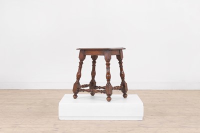 Lot 580 - A small walnut joint stool