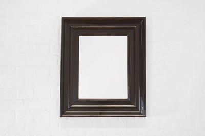 Lot 446 - An ebonised pearwood mirror