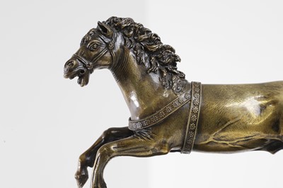 Lot 386 - An equestrian bronze model of a galloping horse