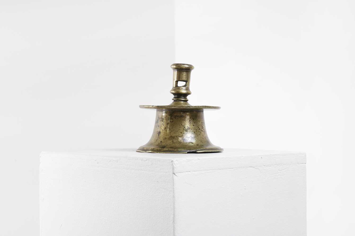 Lot 127 - A bronze capstan candlestick