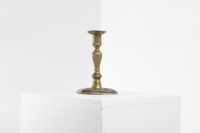 Lot 563 - A brass candlestick