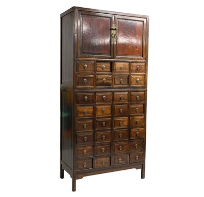 Lot 605 - A Chinese hardwood apothecary cabinet