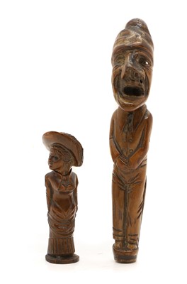 Lot 326 - Two treen carved figural parasol handles