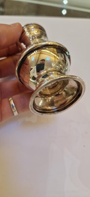 Lot 97 - A pair of silver wine coasters