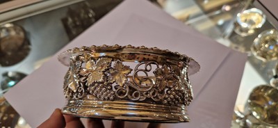 Lot 97 - A pair of silver wine coasters