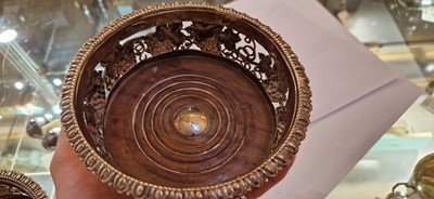 Lot 97 - A pair of silver wine coasters