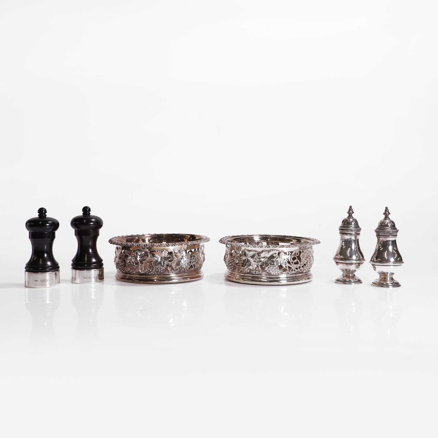 Lot 97 - A pair of silver wine coasters