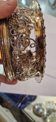 Lot 97 - A pair of silver wine coasters