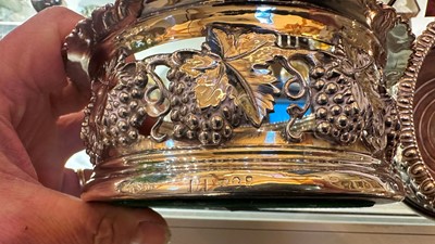 Lot 97 - A pair of silver wine coasters