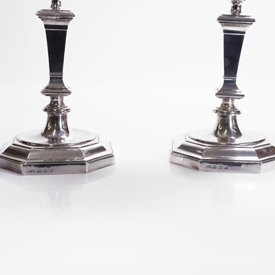 Lot 94 - A pair of silver three-branch candelabra