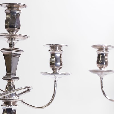 Lot 94 - A pair of silver three-branch candelabra