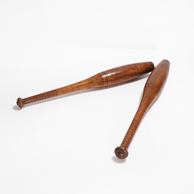Lot 519 - A pair of hardwood exercise batons