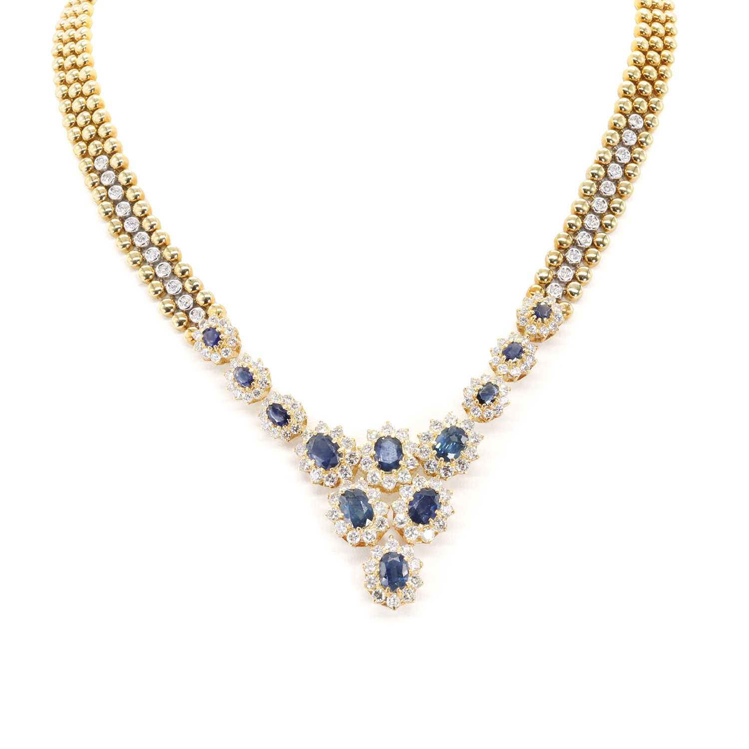 Lot 214 - An 18ct gold sapphire and diamond bib necklace