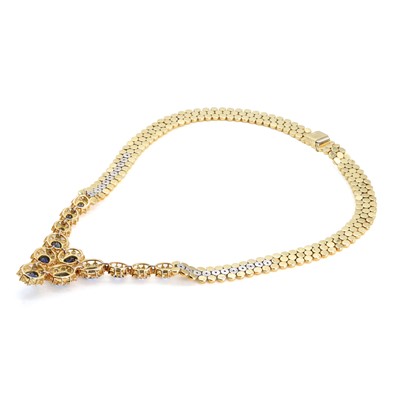 Lot 214 - An 18ct gold sapphire and diamond bib necklace