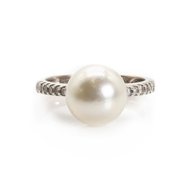 Lot 1195 - A cultured pearl and diamond ring