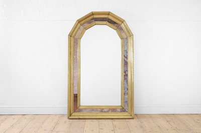 Lot 140 - A brass-clad and verre églomisé pier mirror