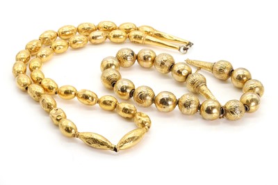 Lot 1250 - A high carat gold necklace and a wax filled gold necklace