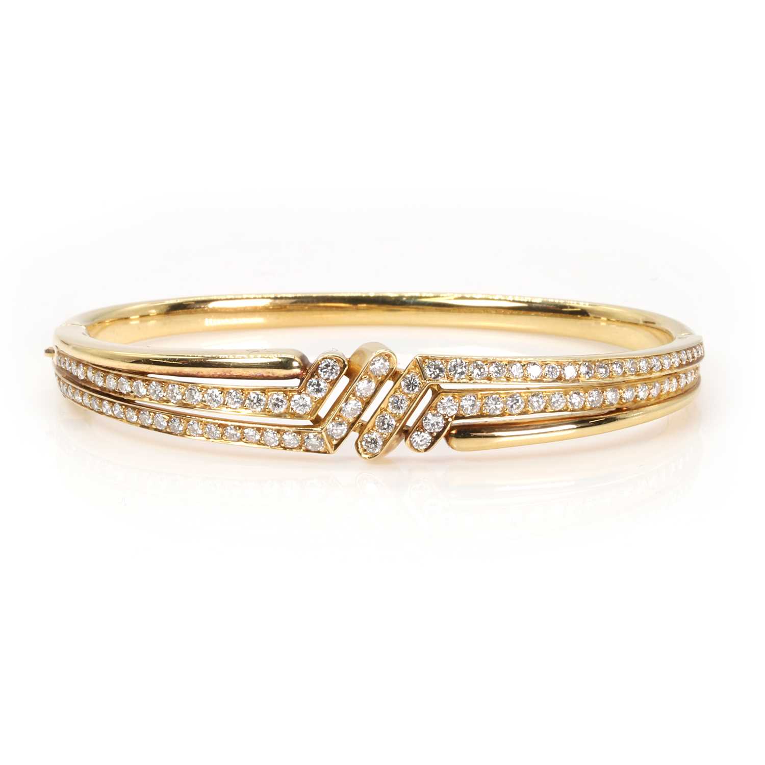 Lot 1127 - An 18ct gold diamond bangle, by OJ Perrin