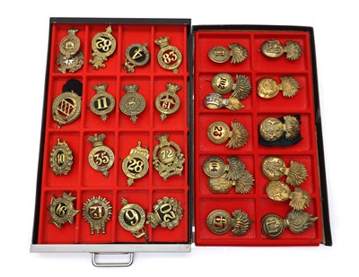 Lot 562 - A collection of thirty British cap badges