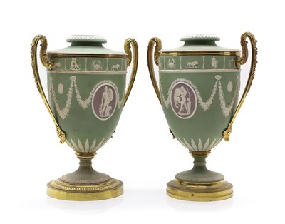 Lot 92 - A near pair of Wedgwood Jasperware neoclassical twin handled urns