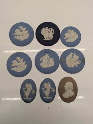 Lot 115 - A collection of plaster plaques