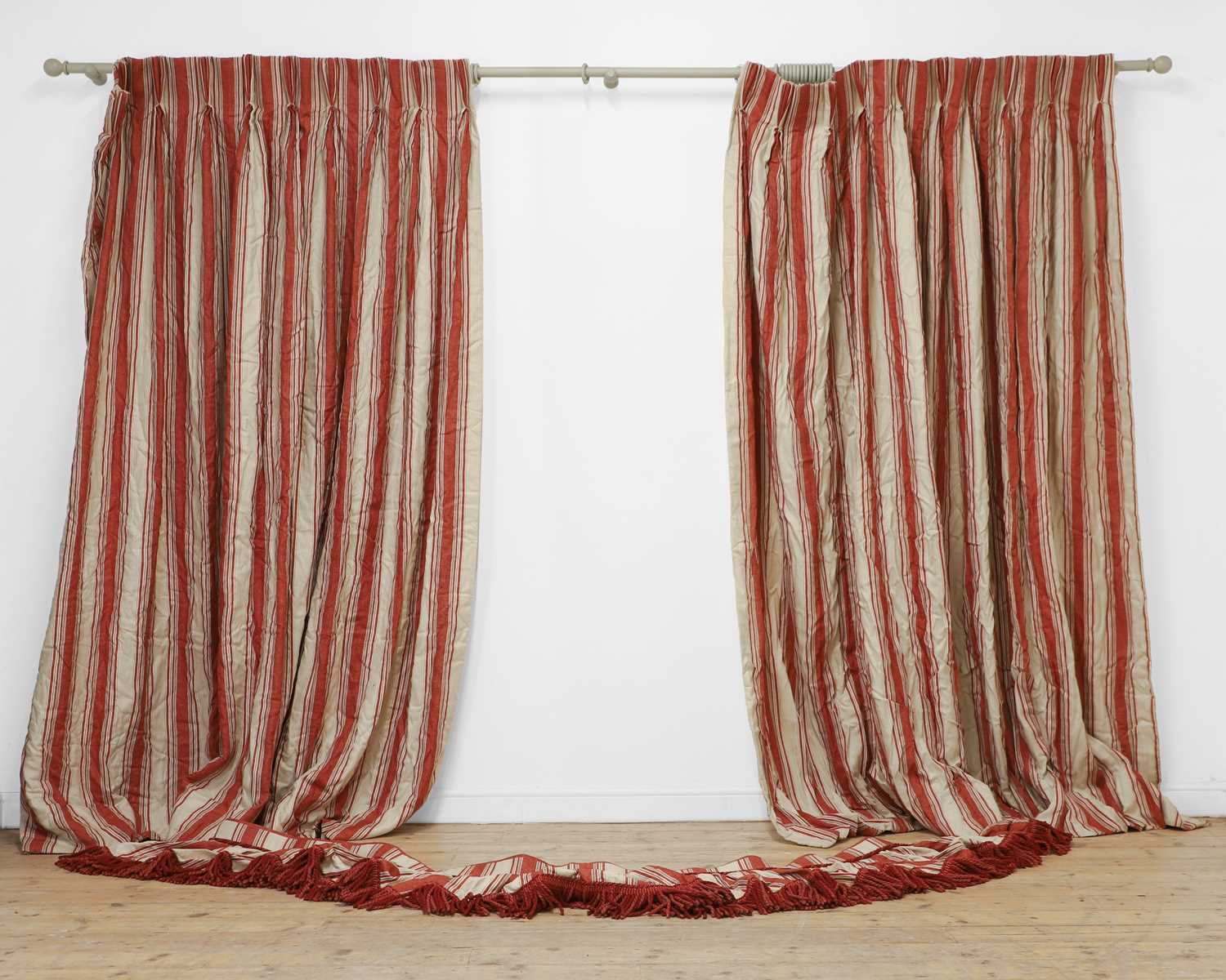 Lot 397 - A pair of red and cream striped linen curtains