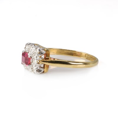 Lot 1174 - A ruby and diamond ring